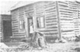 Une maison en bois rond.